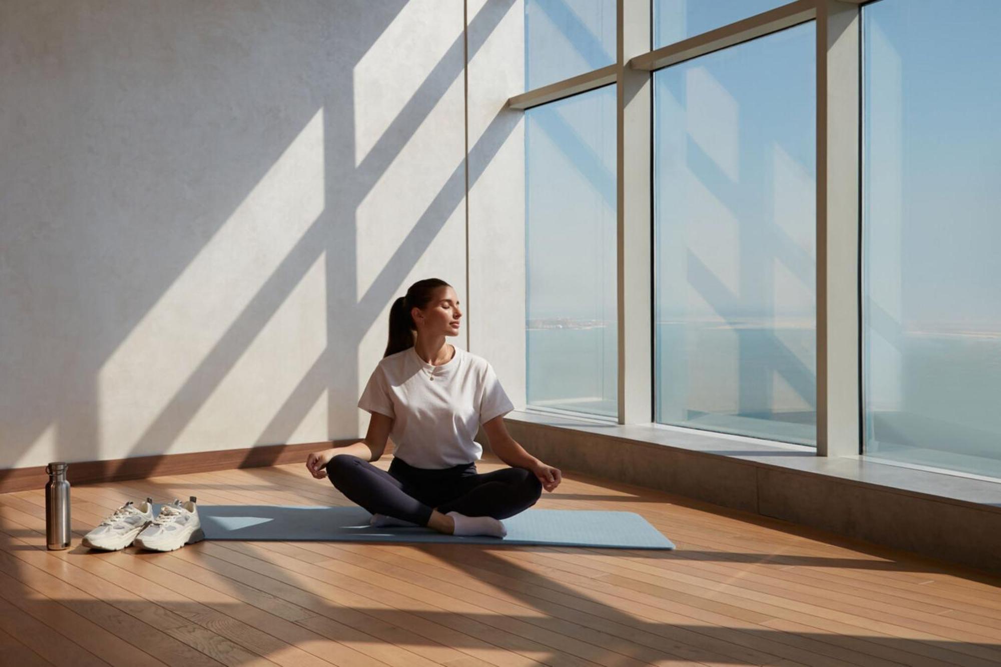 Element By Westin West Bay Doha Hotel Kültér fotó A woman meditating